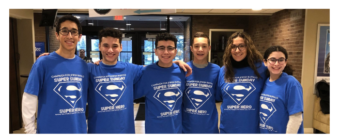 six teenagers who are part of a jewish buffalo federation program wearing blue t-shirts 